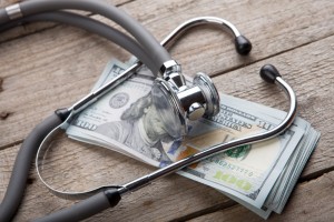 health-insurance-concept-stethoscope-over-the-money-picture